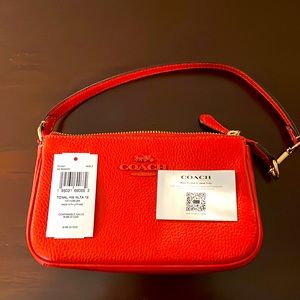 Coach brand new with tags clutch and wallet set.